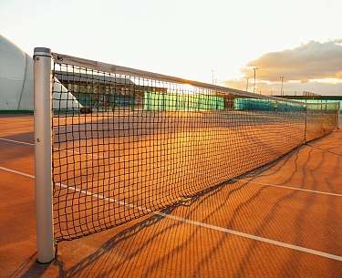 Beautiful tennis court at sunset